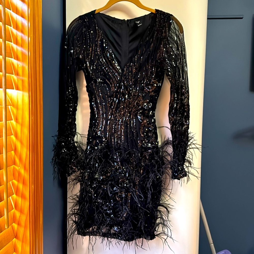sequin with black beads and feather dress comfortable stretch material!